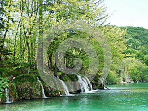 Waterfalls among trees at Plitvice Lakes, Croatia