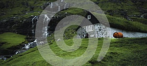 Waterfalls in the village of Saksun on the Faroe islands located on the island of Streymoy, Faroe Islands, Denmark