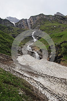 Waterfalls on the way to mountain water reservoirs in Kaprun, Austria