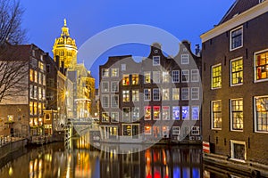 Waterfront canal houses at twilight Amsterdam