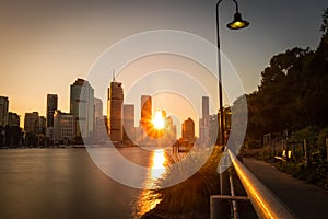 Waterfront of city in golden sunlight