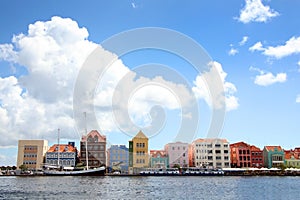 Waterfront of the Dutch Antilles town of Willemstad, with beautiful colourful buildings lining the waters edge, Curacao, Caribbean