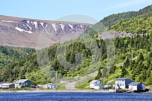 Waterfront homes along Bonne Bay with The Tablelands on the horizon