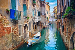 Waterfront houses in narrow water canal, Venice, Italy