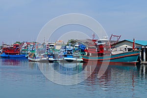 Waterfront marina full of commercial fishing boats