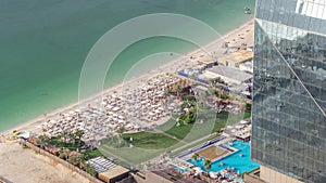 Waterfront overview Jumeirah Beach Residence JBR skyline aerial timelapse with yacht and boats