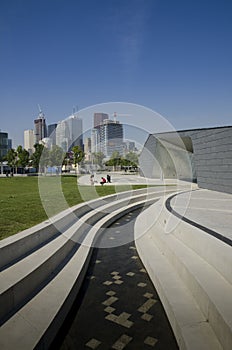 Waterfront park and growing city skyline