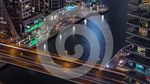 Waterfront promenade in Dubai Marina aerial night timelapse. Dubai, United Arab Emirates