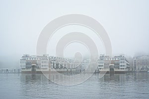 Waterfront residences  in fog, at the Inner Harbor in Baltimore, Maryland