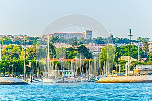 waterfront of river tajo in lisbon with palacio national de ayuda, Portugal photo