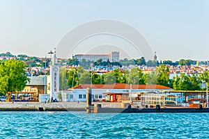 waterfront of river tajo in lisbon with palacio national de ayuda, Portugal photo