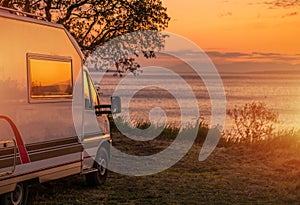 Waterfront RV Camping Site During Scenic Sunset