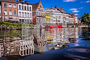 Waterfront`s building reflected in the water of the Meuse river, Ghent, Belgium