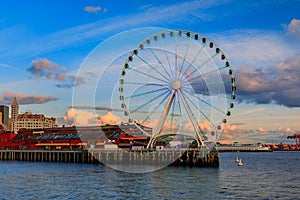 Waterfront skyline with the Great Wheel, the Puget Sound at sunset, Seattle, WA