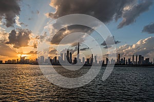 Waterfront view of Burj Khalifa under Cloudy Sky, World Tallest Tower. A view from Sheikh