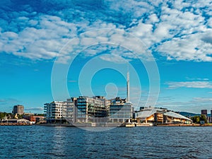 Waterfront view on Oslo city harbor and modern architecture in a sunny summer day. Norway