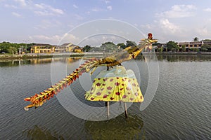 Waterfront view of Thu Bon River, at Hoi An ancient town historic district, UNESCO world heritage site. Vietnam.