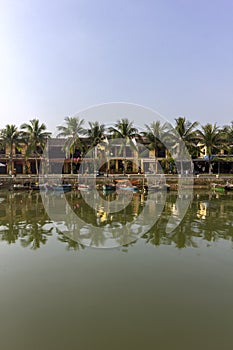 Waterfront view of Thu Bon River, at Hoi An ancient town historic district, UNESCO world heritage site. Vietnam.