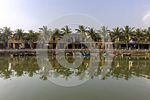 Waterfront view of Thu Bon River, at Hoi An ancient town historic district, UNESCO world heritage site. Vietnam.