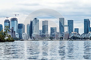 Waterfront view of Toronto City Skyscrapers along with CN Tower and Rogers Centre, Scarborough districts in summer, a view from To