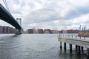 Waterfront of Williamsburg Brooklyn New York with the Williamsburg Bridge and a view of the Lower East Side of New York City photo