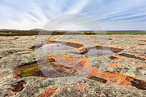 Waterholes full of rain water on top of a granite rock. Aboriginal people relied on rock holes as water sources. Eyre Peninsula,