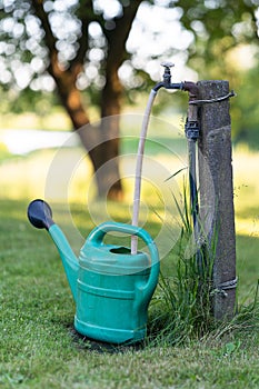 Watering can placed in the garden