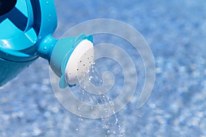 Watering can in the swimming pool