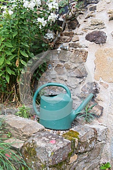 Watering can at the tap