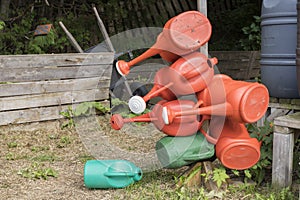 Watering cans and watter barrels in community garden