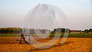 Watering the fields during sunset