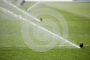 Watering the lawn water grass football field