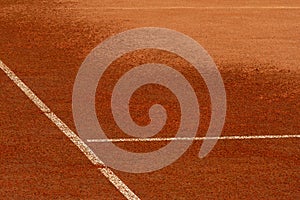 Watering or moistening of clay tennis court. Surface of sports field, marking lines are visible. Design element. Fragment of
