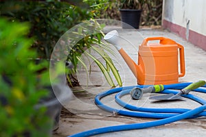 Watering and trovel for plant or tree at garden