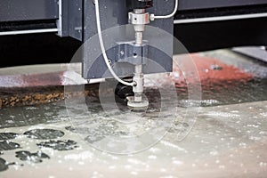 Waterjet cutting cnc machine in working photo
