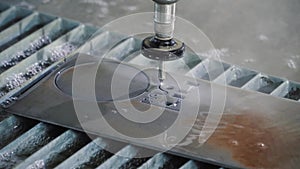 Waterjet metal cutting. Hydroabrasive high pressure CNC machine