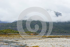 Waterless bay during low tide on a cloudy day near Digermulen at Lofoten islands