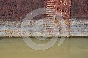 Waterline on old and rusty ship