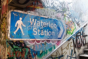 Waterloo Station sign with graffiti