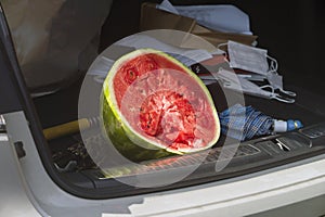 Watermellon in a car trunk