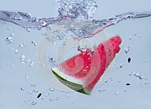 Watermellon fallen into the water and splashed