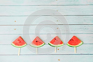 Watermelon on blue wooden background  summer holidays vacation concept