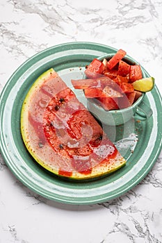 Watermelon with chili powder and chamoy. Mexican food photo