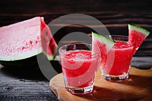 Watermelon cocktail on a wooden table.