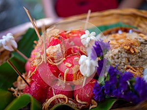 watermelon cut to sphere shape pieces serve with seasoning powder