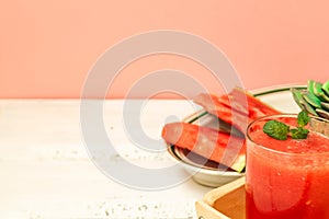 Watermelon drink and abuza slices. Watermelon and gin punch on the table in a summer bar, party. Summer refreshing drink
