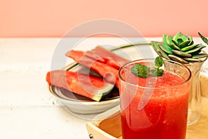 Watermelon drink and abuza slices. Watermelon and gin punch on the table in a summer bar, party. Summer refreshing drink