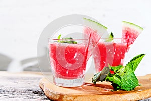 Watermelon drink in glasses with slices of watermelon