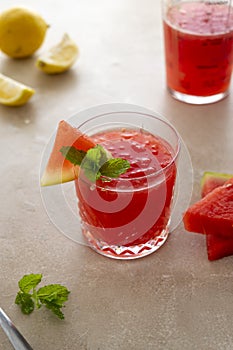 Watermelon drink, juice, lemonade with lemon and fresh mint leaves. Refreshing summer drink. DEtox healthy beverage photo
