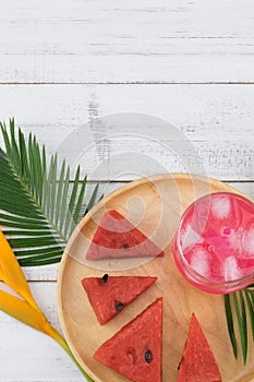 Watermelon fresh drink and watermelon on wooden plate